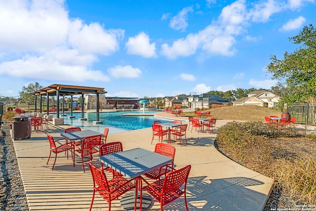 view of swimming pool featuring a patio and pool water feature