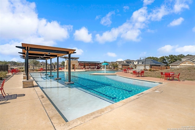 view of swimming pool with a patio area