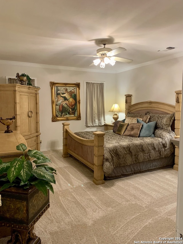 bedroom featuring light colored carpet, crown molding, and ceiling fan