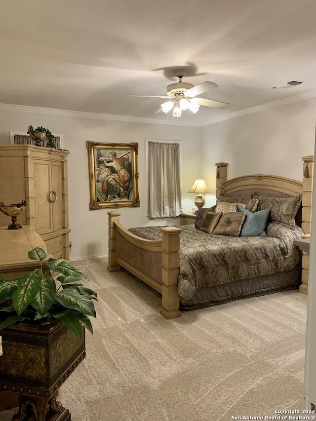 bedroom with visible vents, ornamental molding, a ceiling fan, light carpet, and baseboards