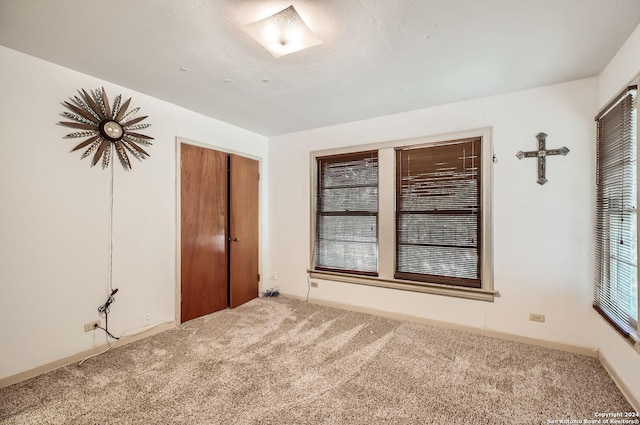 unfurnished bedroom featuring carpet flooring