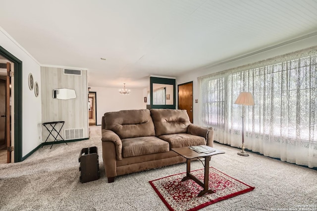 living room featuring a chandelier and light carpet