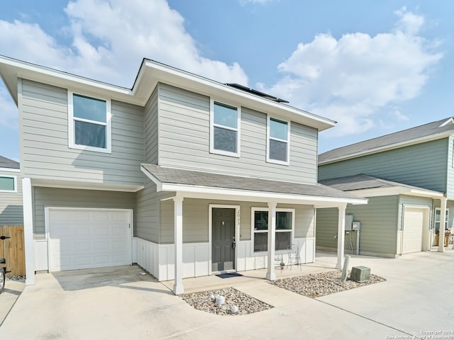 view of front of house featuring covered porch and a garage