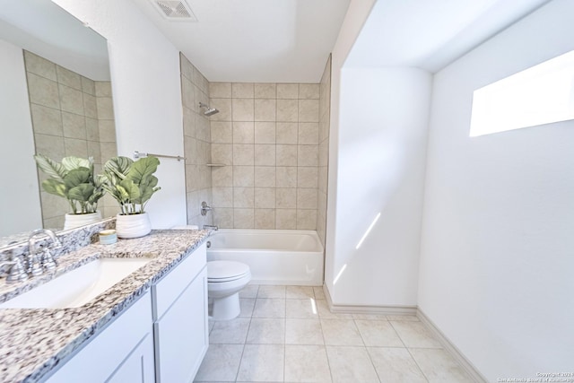 bathroom featuring visible vents, toilet, tub / shower combination, vanity, and tile patterned flooring