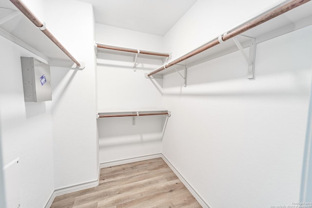 spacious closet with light wood-style floors