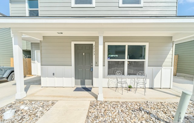 doorway to property with covered porch