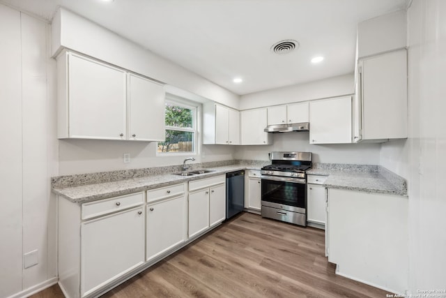 kitchen with white cabinets, gas stove, light hardwood / wood-style floors, sink, and black dishwasher