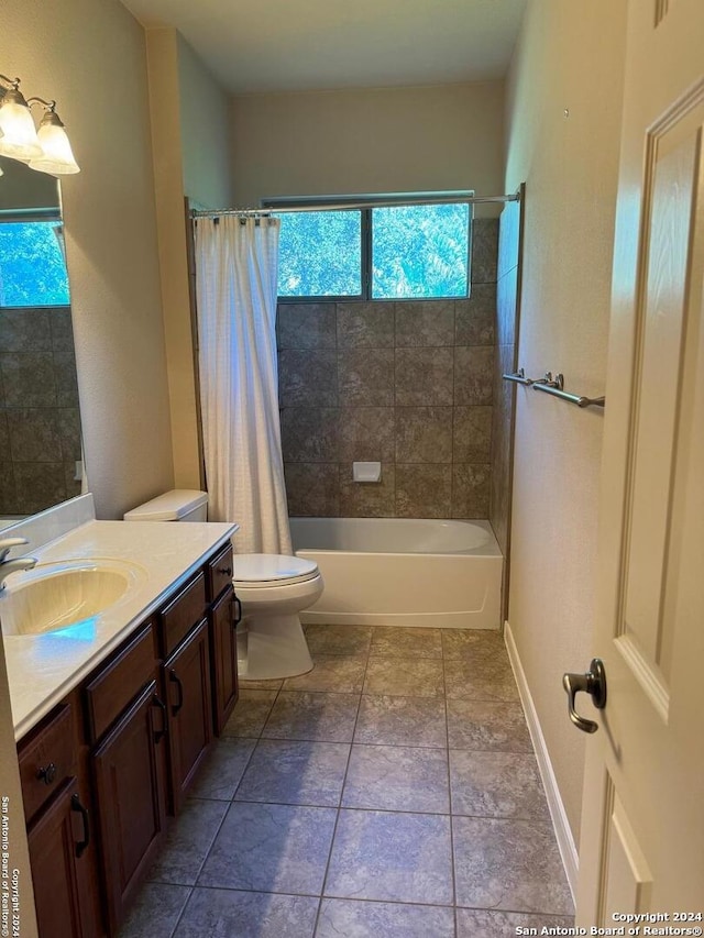 full bathroom featuring toilet, tile patterned flooring, shower / bathtub combination with curtain, and vanity