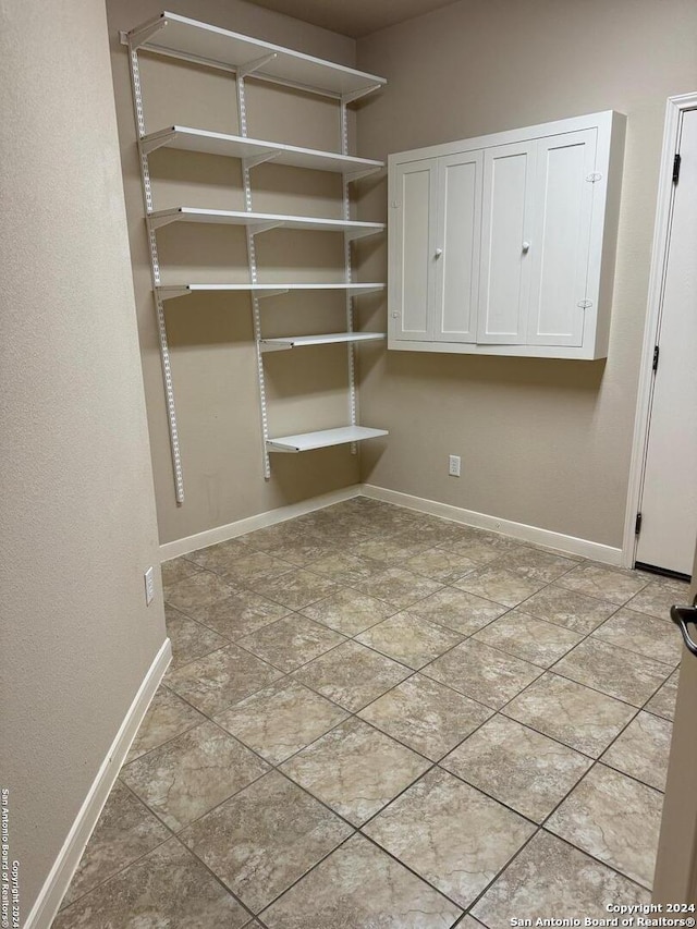 interior space with light tile patterned floors