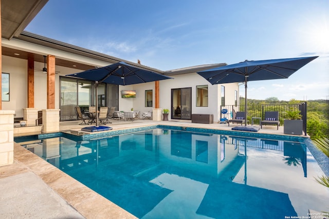 outdoor pool featuring a patio and fence