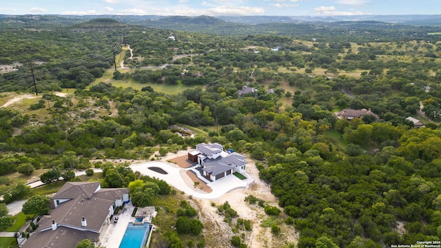 aerial view featuring a view of trees