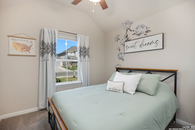 carpeted bedroom featuring ceiling fan and vaulted ceiling