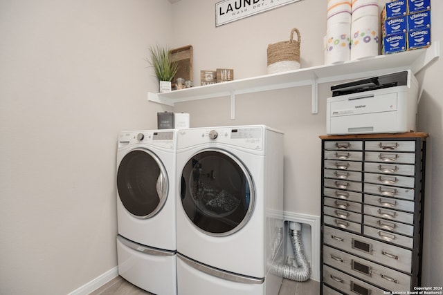 laundry room with independent washer and dryer