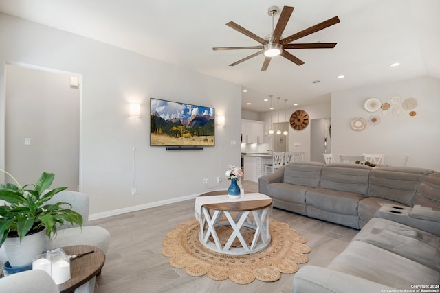 living room featuring ceiling fan and light hardwood / wood-style floors