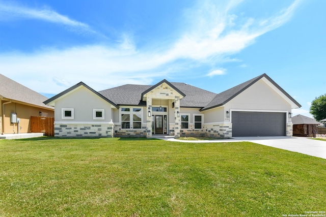 view of front of house with driveway, stone siding, an attached garage, fence, and a front lawn