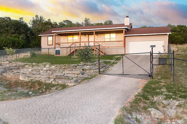 view of front of property with a garage and a porch