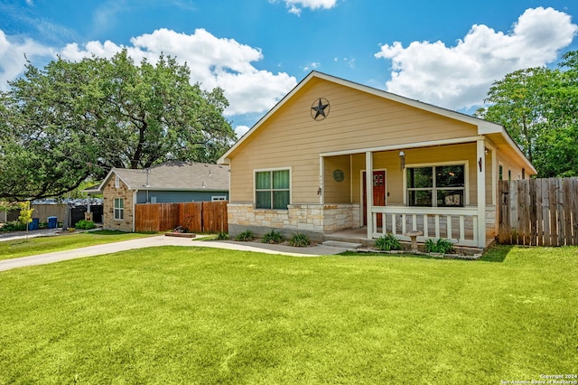 view of front of property with a front lawn and a porch