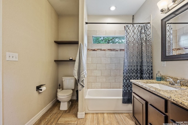 full bathroom featuring shower / bath combo with shower curtain, vanity, hardwood / wood-style floors, and toilet