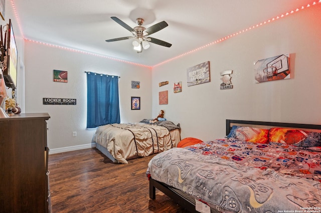 bedroom featuring ceiling fan and dark wood-type flooring