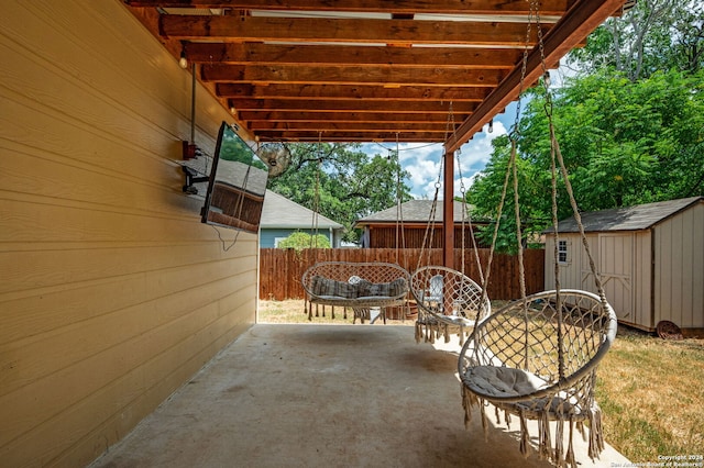 view of patio / terrace with a storage shed