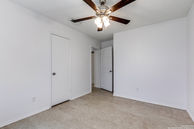 unfurnished bedroom with ceiling fan and light carpet