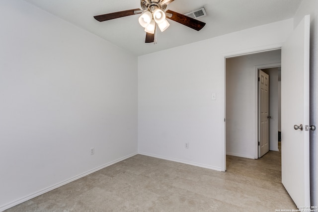 carpeted empty room with ceiling fan