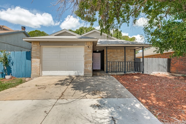 ranch-style house featuring a garage