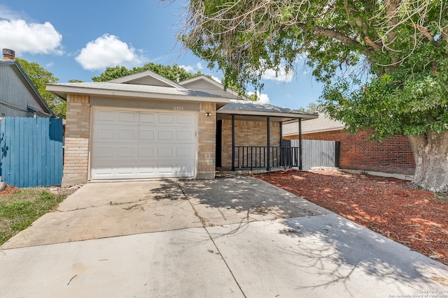 ranch-style house featuring a garage