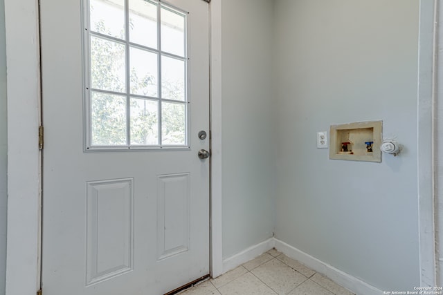 entryway featuring light tile patterned flooring