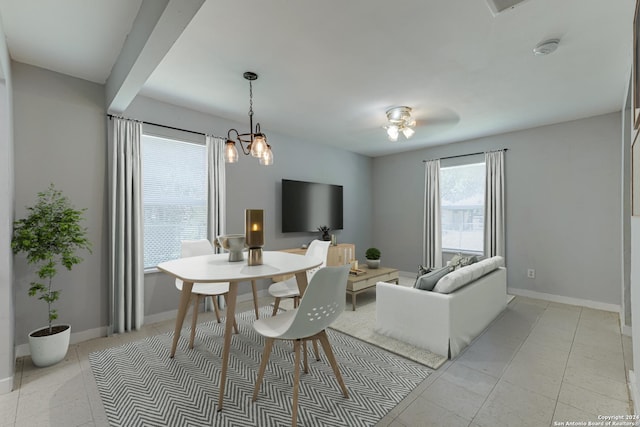 dining room featuring light tile patterned floors and baseboards