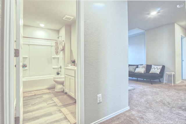 full bathroom with wood-type flooring, toilet, shower / tub combination, and vanity