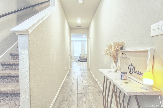 hallway featuring light wood-type flooring