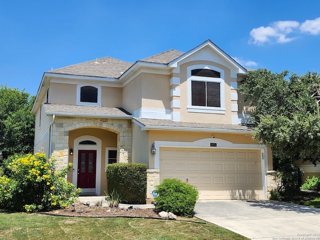 view of front of home featuring a front yard and a garage