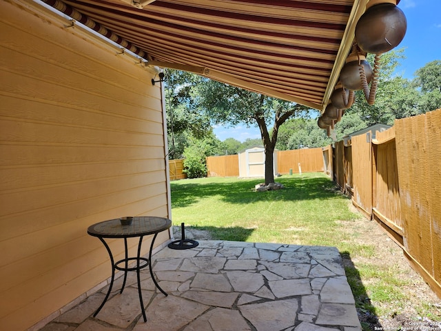 view of patio featuring a shed