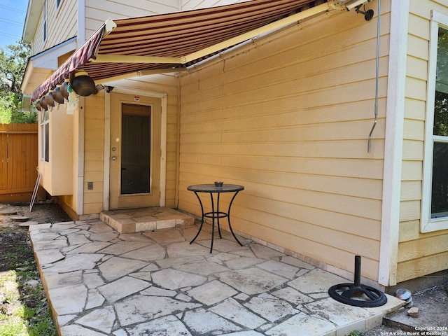 entrance to property with a patio