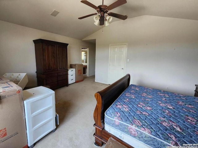 bedroom with light carpet, vaulted ceiling, and ceiling fan