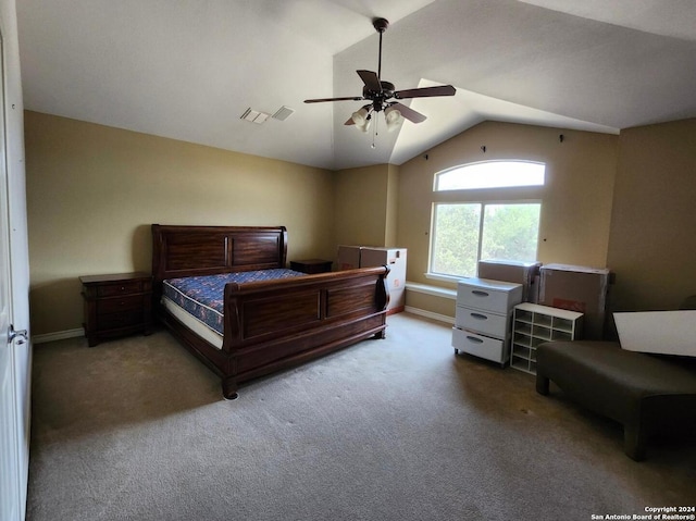 carpeted bedroom with vaulted ceiling and ceiling fan