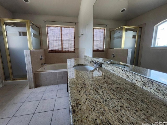 bathroom featuring vanity, independent shower and bath, and tile patterned flooring