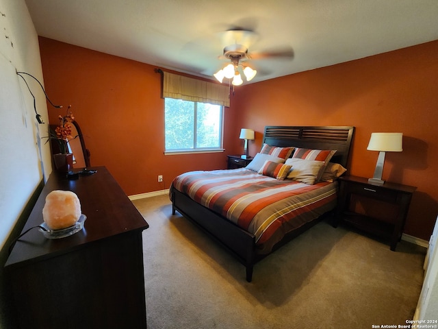 bedroom with light carpet and ceiling fan