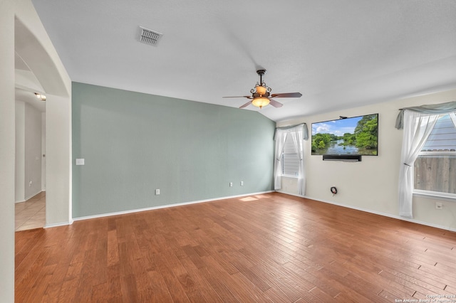 spare room with ceiling fan and wood-type flooring