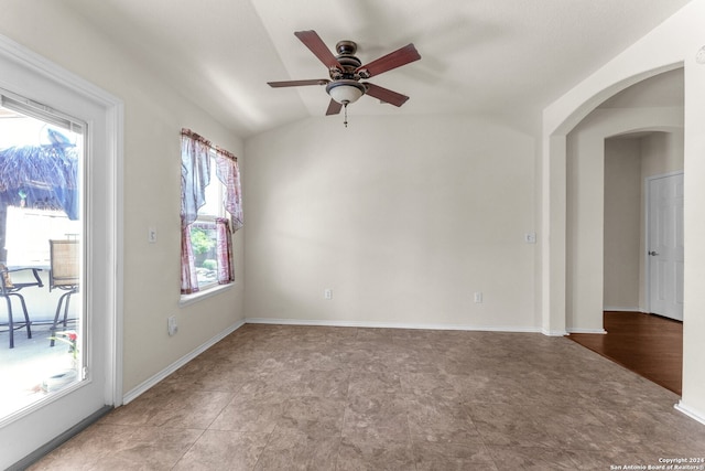 unfurnished room featuring ceiling fan, plenty of natural light, and tile patterned flooring