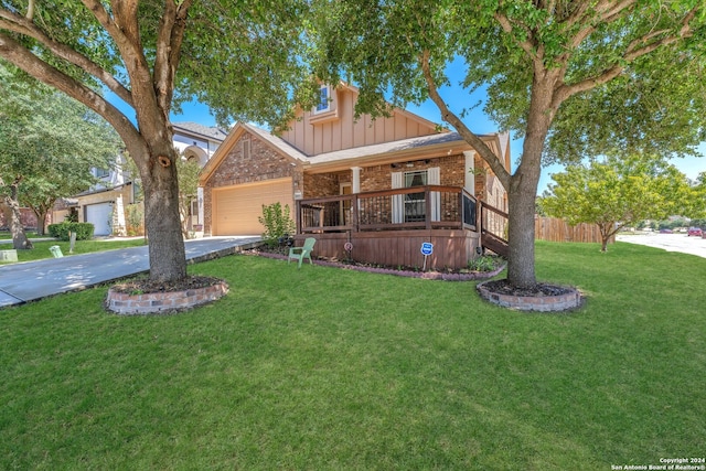 view of front of property featuring a garage and a front lawn