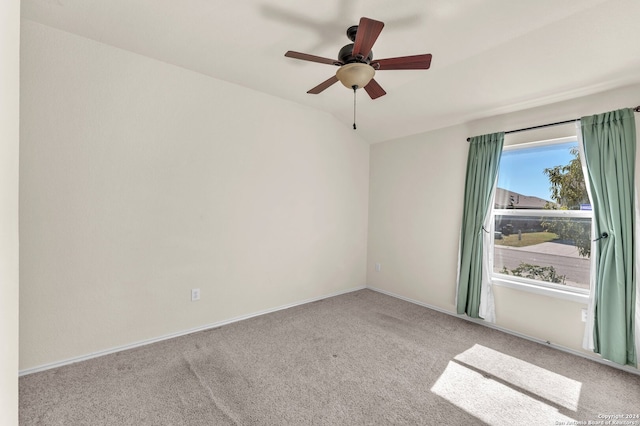 carpeted empty room featuring ceiling fan