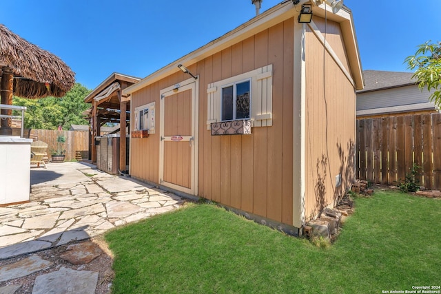 view of outbuilding featuring a yard