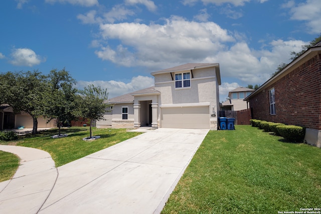 view of front of property featuring a front lawn and a garage