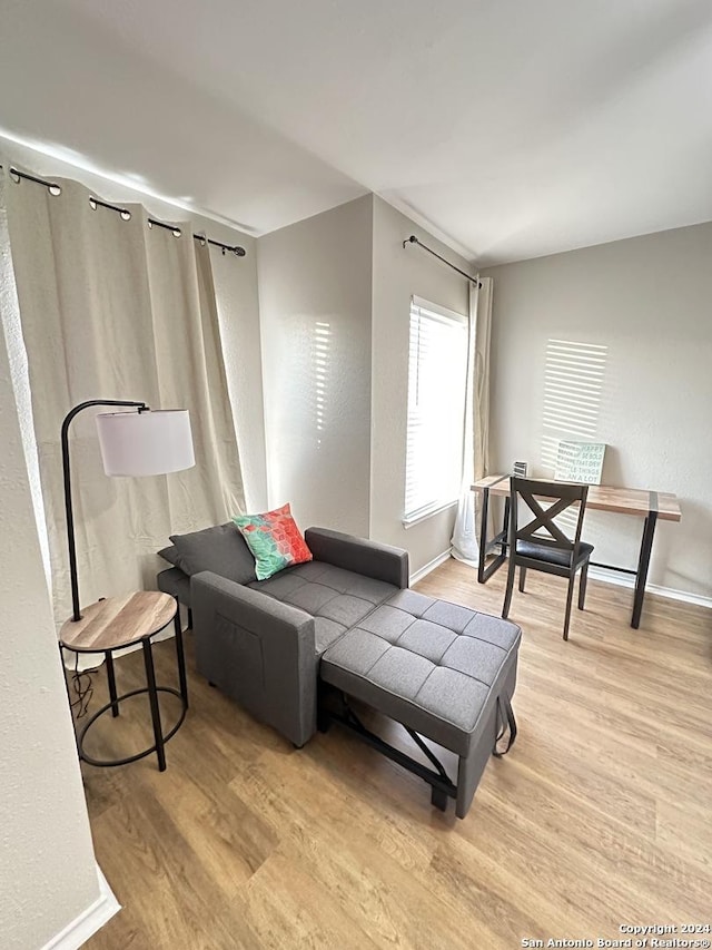 living room with wood finished floors and baseboards