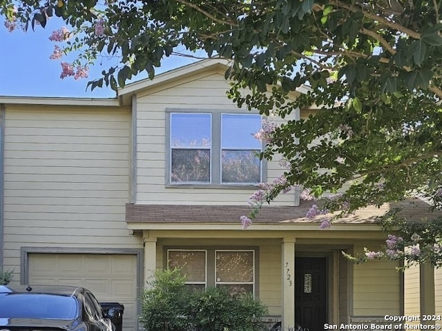 view of side of home with a garage