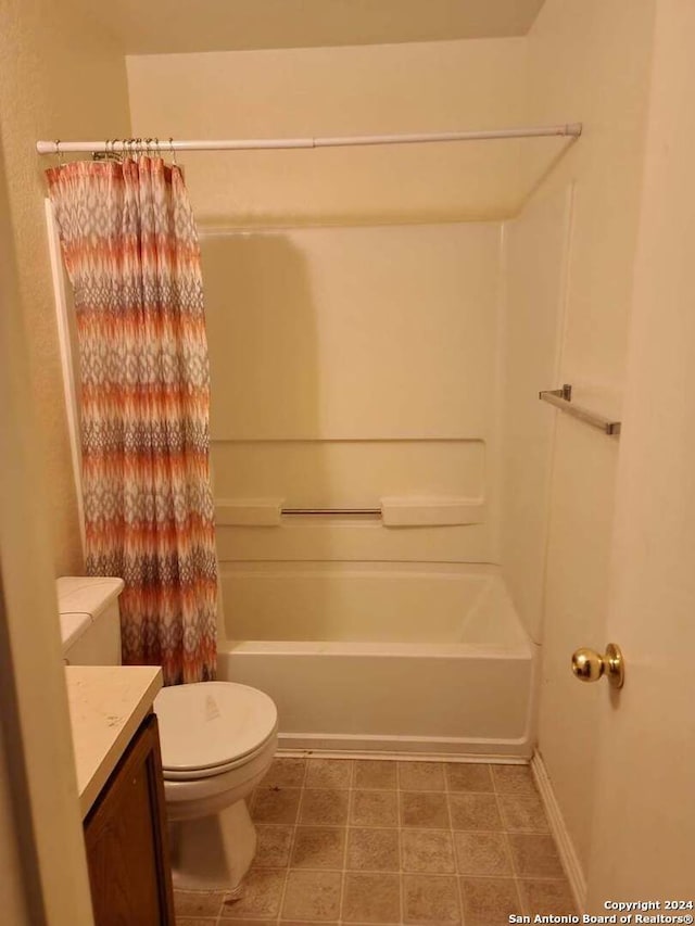 full bathroom with tile patterned floors, vanity, shower / tub combo, and toilet