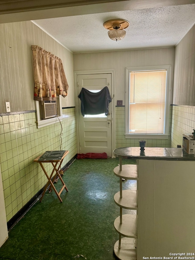 kitchen featuring a textured ceiling and cooling unit