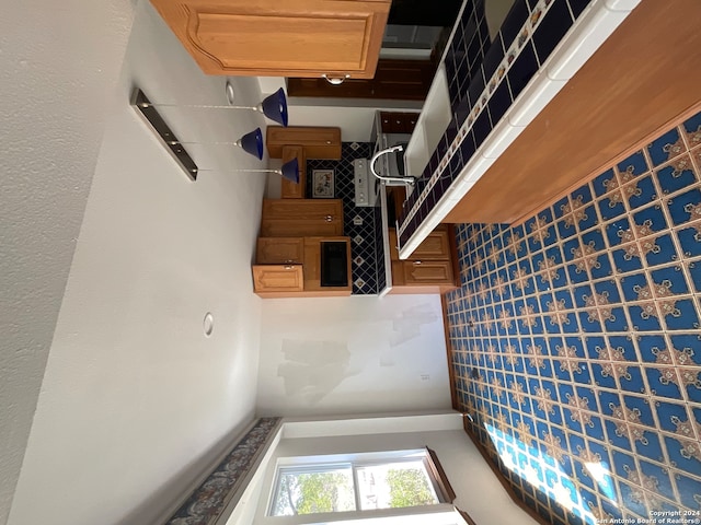 kitchen with tile walls